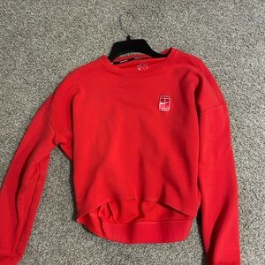 Red cropped Nike court pullover, size small